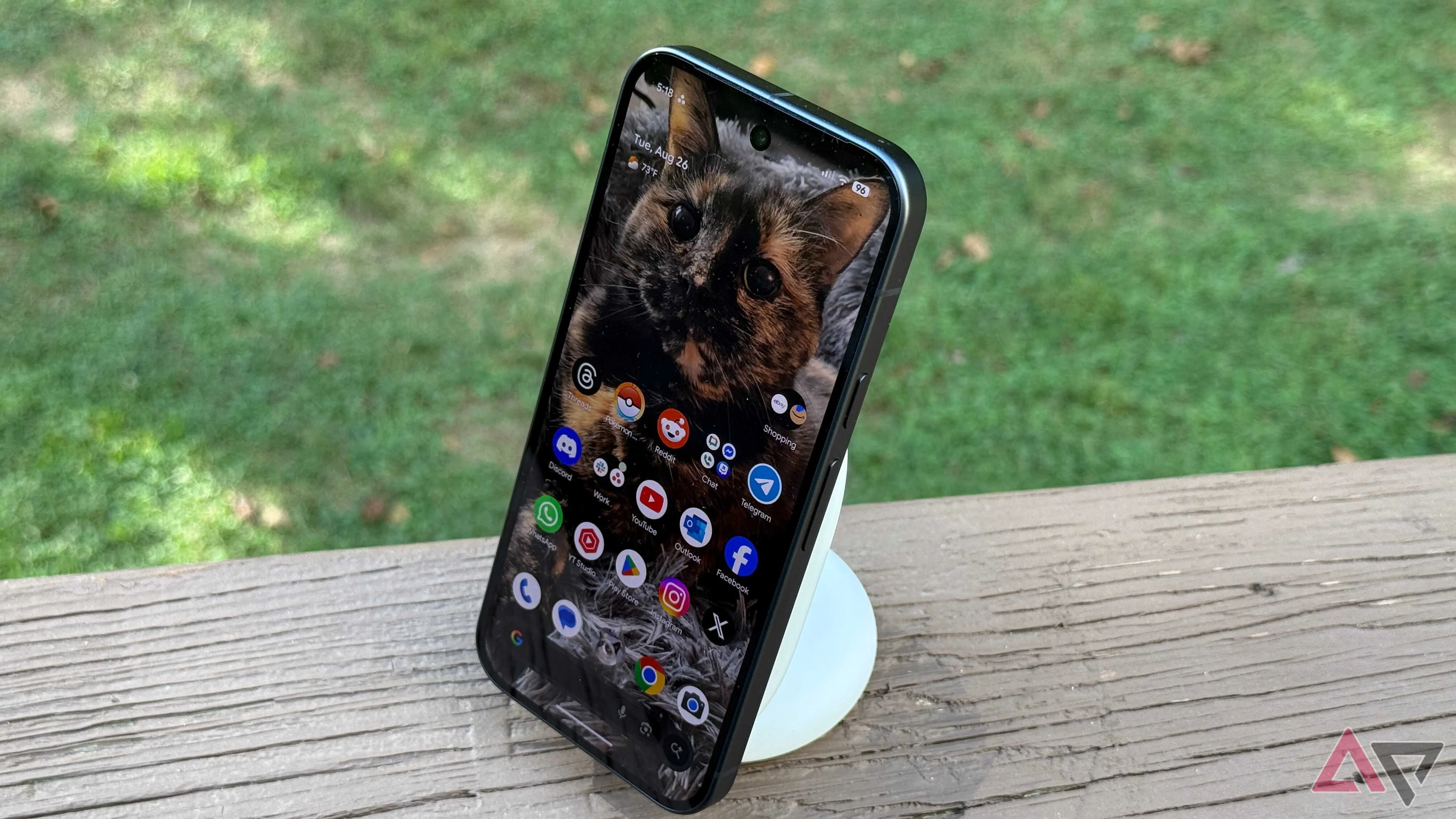 Google Pixel 10 sitting on a Pixelsnap charging stand