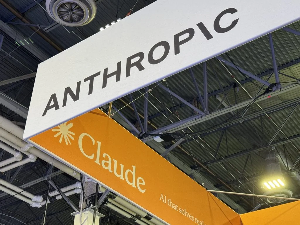 Anthropic logo on a conference show floow.